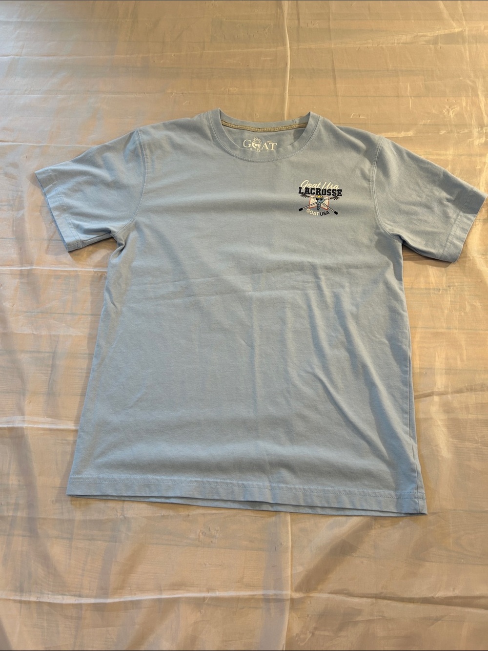 GOAT Light Blue Lacrosse Graphic Short Sleeve Tee - Men's